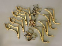 Lot 327 - A set of four gilt metal curtain pole brackets