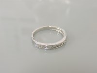 Lot 5 - An 18ct white gold half hoop diamond eternity ring