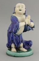 Lot 408 - A Chinese biscuit porcelain figure