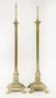 Lot 488 - A pair of brass Corinthian column standard lamps