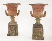 Lot 573 - A pair of reconstituted stone campana urns