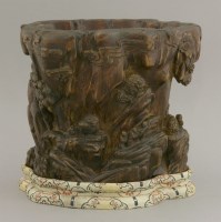 Lot 242 - A well carved wood Bitong