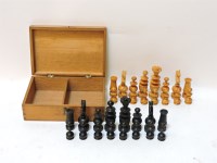 Lot 1115 - A carved boxwood and ebonised 'Regence' pattern chess set