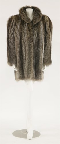 Lot 1112 - A raccoon mid-length fur coat