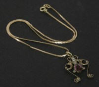 Lot 88 - A gold garnet and split pearl pendant
