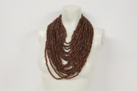 Lot 75 - An eighteen row amber coloured bead necklace