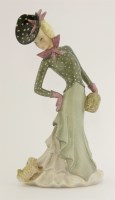 Lot 192 - A Lenci figure of a lady looking at a dog on the hem of her dress