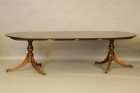 Lot 591 - An early 20th century mahogany twin pillar 'D' end dining table