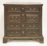 Lot 303 - An oak chest of four long drawers
