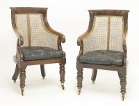 Lot 365 - A pair of George IV mahogany bergère library chairs
