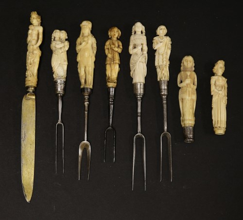 Lot 31 - Eight carved ivory figural cutlery handles