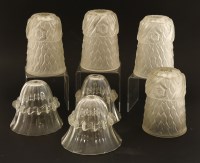 Lot 243 - Four Art Deco moulded glass shades
