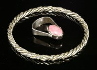 Lot 1608 - A sterling silver twisted wire slave bangle