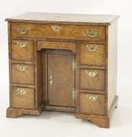 Lot 330 - A George II walnut kneehole desk