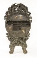 Lot 342 - A Japanese carved blackwood cabinet
