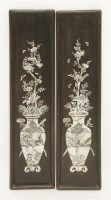 Lot 376 - A pair of wood hanging panels