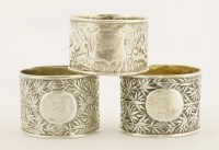 Lot 276 - Three Chinese silver napkin rings