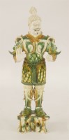 Lot 396 - A Chinese sancai guardian figure