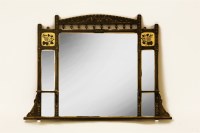 Lot 544 - An Aesthetic Movement style mirror with ebonised and gilded frame