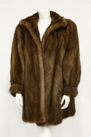 Lot 1399 - A caramel coloured mid-length mink jacket