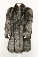Lot 1403 - An Italian Arctic fox fur mid-length coat
lined in a black paisley silk fabric