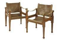 Lot 634 - A pair of safari chairs