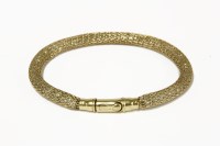 Lot 214 - A Continental gold mesh bracelet enclosing cubic zirconia stones