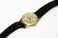 Lot 249 - A gentlemen's 9ct gold Garrard Automatic strap watch