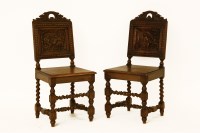 Lot 759 - A pair of oak hall chairs