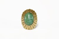Lot 212 - A gold single stone turquoise cabochon ring