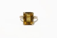 Lot 218 - A gold single stone emerald cut citrine ring