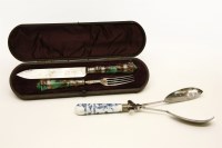 Lot 277 - A Victorian knife and fork with mottled pottery handles and engraved palm trees