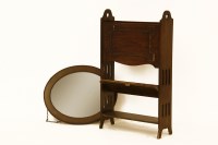 Lot 760 - Arts and Crafts oak magazine rack/bookshelf