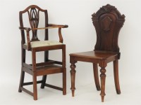 Lot 698 - A carved hall chair