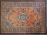 Lot 827 - A large red ground possibly Chinese carpet the red ground with geometric designs within a multiple banded boarder. 280cm x 370cm