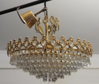 Lot 574 - Three 1970's tiered form crystal drop shallow hanging chandeliers