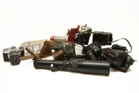 Lot 488 - A quantity of cameras including examples by Canon