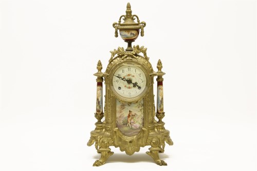 Lot 377 - A gilt metal and porcelain mantle clock