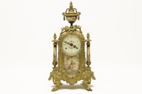 Lot 377 - A gilt metal and porcelain mantle clock