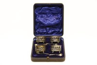 Lot 320 - A cased set of four pierced oval silver salts and spoons