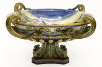 Lot 621 - A large Italian maiolica footed bowl with a classical figurative scene and quadruple looped handles modelled as snakes
53cm wide x 23 cm high