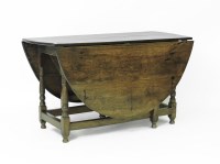 Lot 763 - An oval oak gateleg table