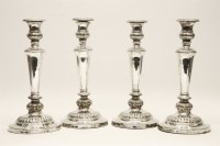 Lot 325 - A set of four Sheffield plated candlesticks