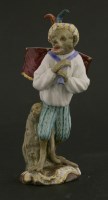 Lot 329 - A Meissen style porcelain figure of a monkey drummer