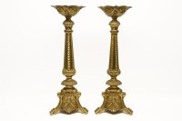 Lot 541 - A pair of brass church candlesticks