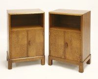Lot 156 - A pair of Heal's oak bedside cabinets