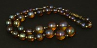 Lot 240 - A set of WMF 'Myra' graduated iridescent glass beads