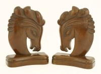 Lot 192 - A pair of carved wood horse head bookends