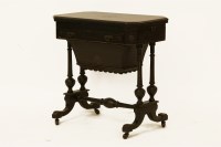 Lot 814 - An aesthetic ebonised work table/games table