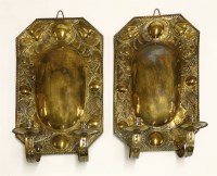 Lot 73 - A pair of Arts and Crafts gilt brass twin-branch wall sconces
